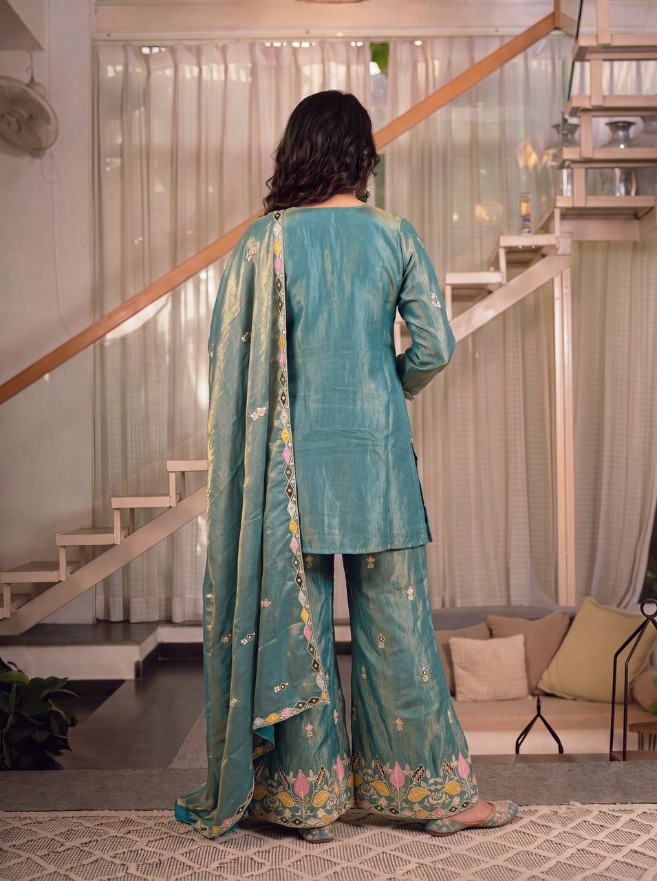 Elegant Rust Orange Silk Kurta and Flared Palazzo Set Adorned with Intricate Multicolored Botanical Embroidery and Mirror Work
